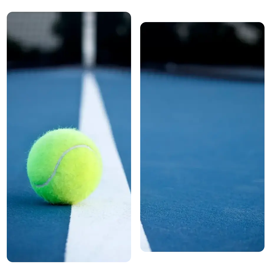 Tennis ball sitting on the court line