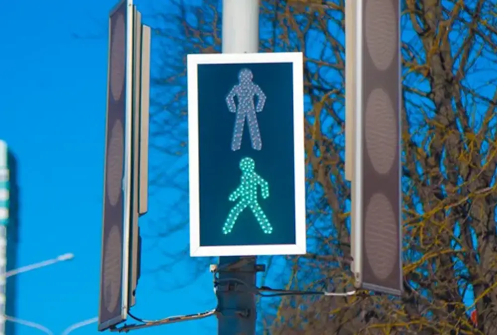 Traffic crossing man green